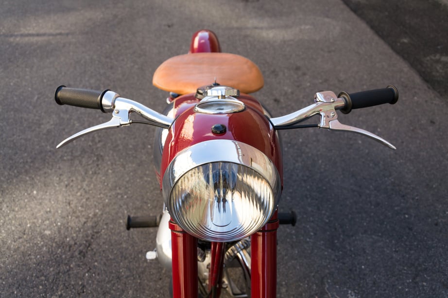 Red vintage motorcycle Jawa 125 produced in former Czechoslovakia